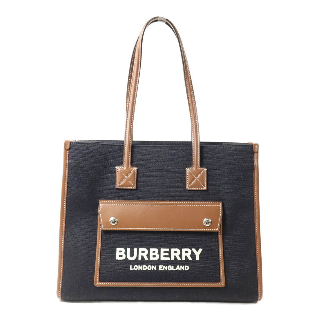 Burberry Freya black canvas tote bag: Burberry Freya black canvas tote bag This Burberry Freya tote bag features a stylish design crafted from durable canvas in black with brown accents. Designed for versatility, it is suitable for both m