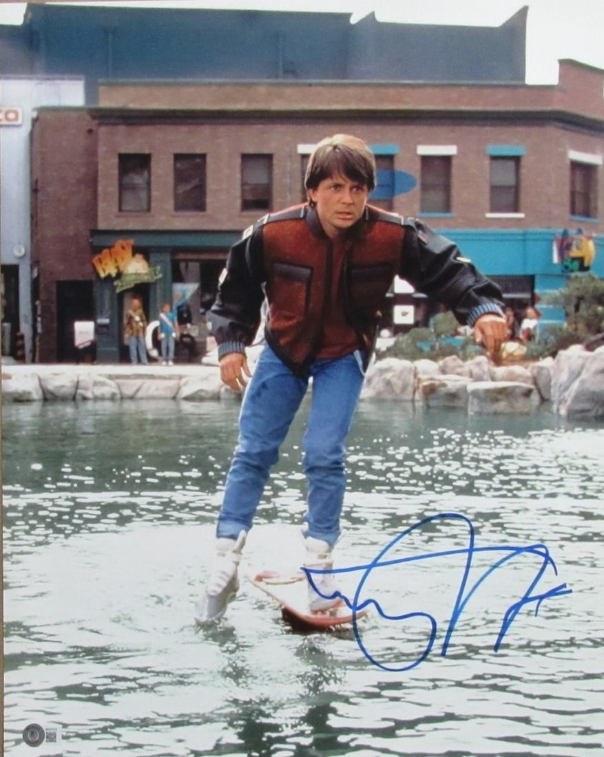 16x20 Photo Signed by Michael J Fox Back to the Future Beckett Authenticated: 16x20 Photo Signed by Michael J Fox Back to the Future Beckett Authenticated This 16x20 photograph from "Back to the Future" features the authentic signature of Michael J. Fox. The photo is certified 