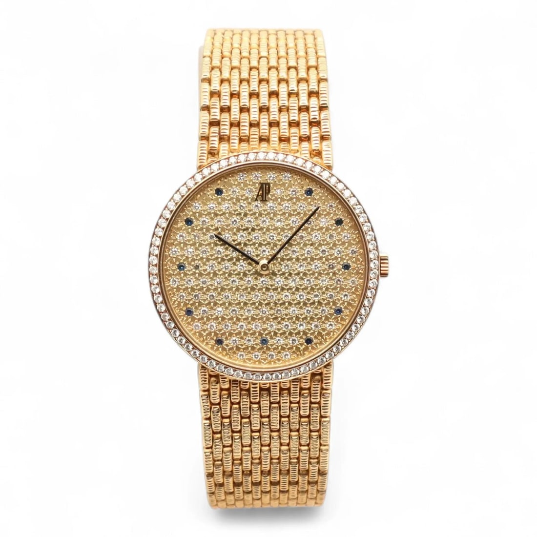 Cobra 31mm Yellow Gold Wristwatch With Diamond Sapphire Dial: Cobra 31mm Yellow Gold Wristwatch With Diamond Sapphire Dial This Audemars Piguet Cobra wristwatch features a 31mm round case crafted from 18K yellow gold with a polished finish. The champagne dial is