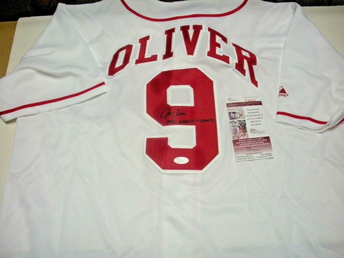 Joe Oliver Autographed Majestic Jersey Cincinnati Reds 1990 Champions JSA COA: Joe Oliver Autographed Majestic Jersey Cincinnati Reds 1990 Champions JSA COA This official Majestic jersey is signed by Joe Oliver of the Cincinnati Reds, commemorating the 1990 championship team. Th