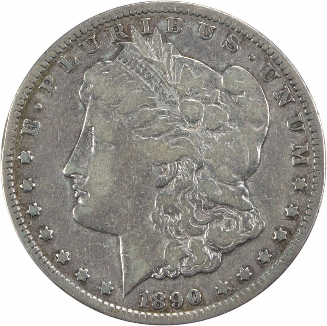 1890-CC Morgan Silver Dollar VF Uncertified 90% Silver Coin: 1890-CC Morgan Silver Dollar VF Uncertified 90% Silver Coin This 1890-CC Morgan Silver Dollar features a striking design by George T. Morgan and is a sought-after collectible for coin enthusiasts. It 
