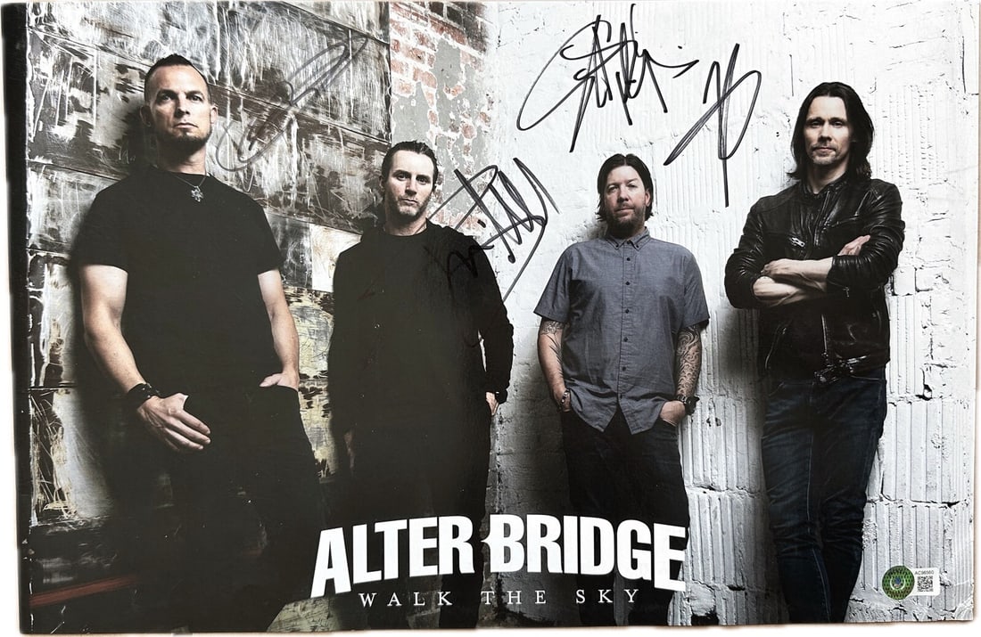 17x11 Poster Signed by Alter Bridge Band with Beckett LOA: 17x11 Poster Signed by Alter Bridge Band with Beckett LOA This is an original 17x11 inch poster autographed in black permanent marker by Myles Kennedy, Mark Tremonti, Scott Phillips, and Brian Marshal