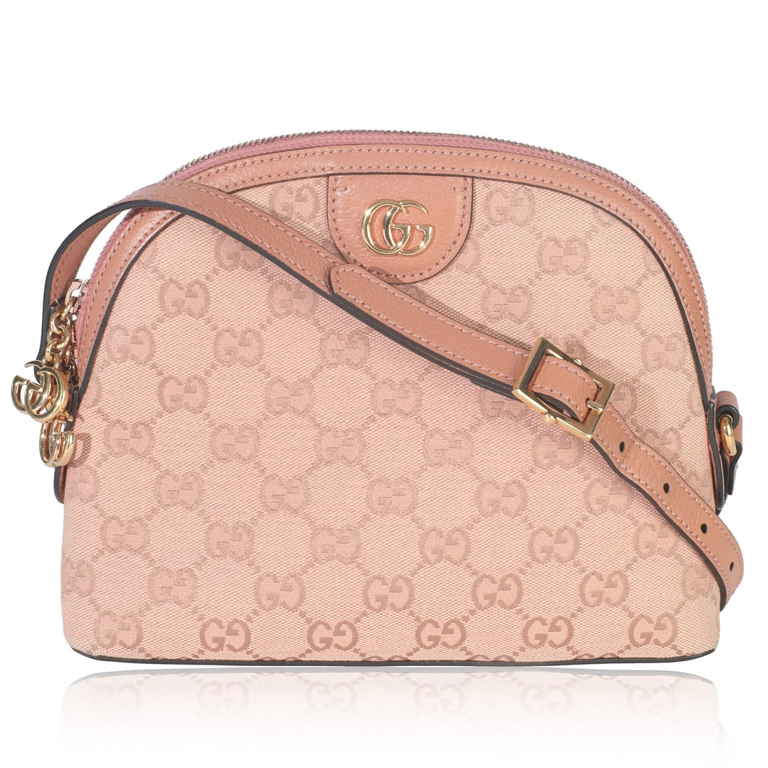 Pink Small Dome Ophidia Crossbody by Gucci in GG Canvas and Leather: Pink Small Dome Ophidia Crossbody by Gucci in GG Canvas and Leather This Gucci Small Dome Ophidia Crossbody Bag features a pink GG canvas exterior with leather and fabric materials. The bag is designe