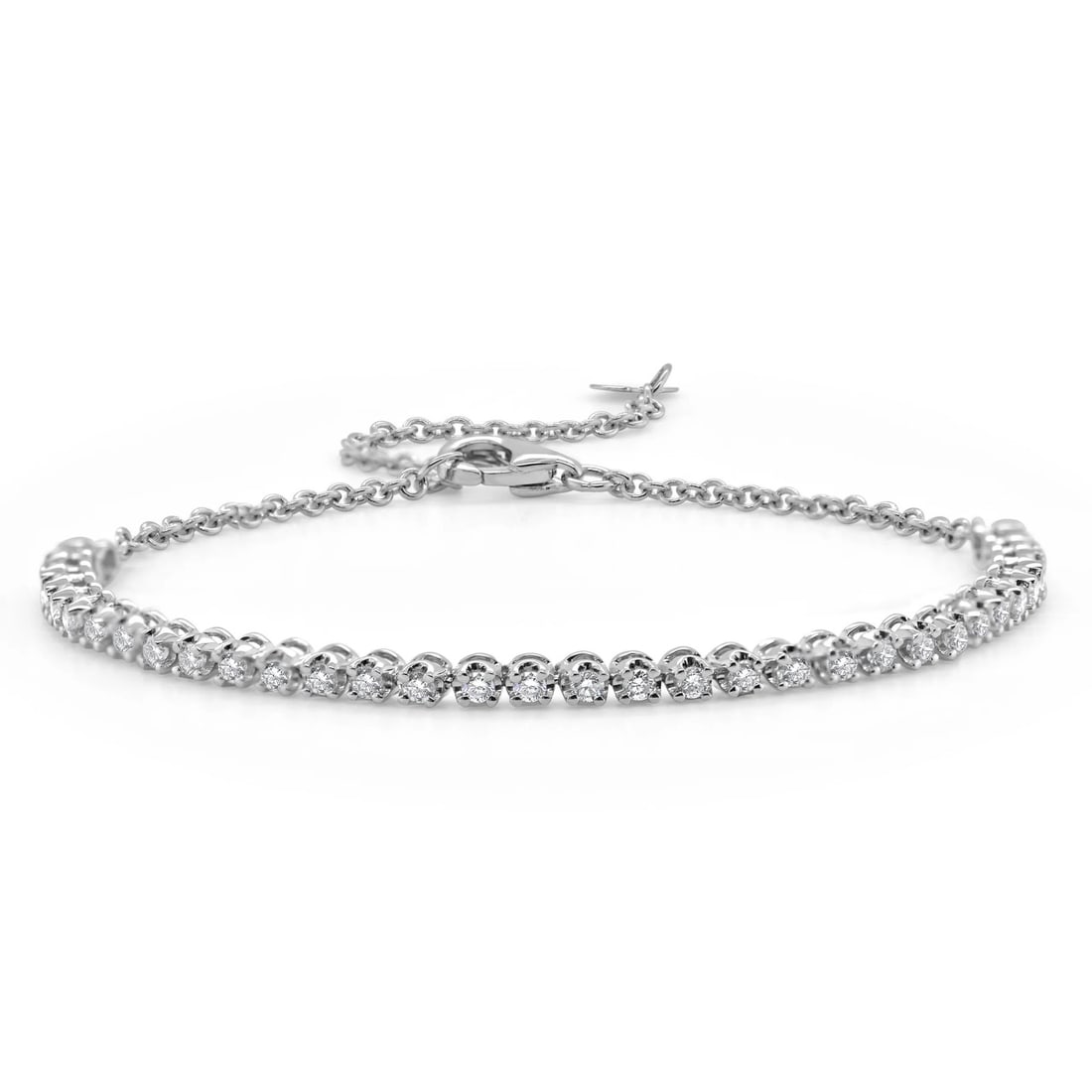 14K White Gold Bracelet with Diamonds by Sabrina Designs Co.: 14K White Gold Bracelet with Diamonds by Sabrina Designs Co. This pre-owned unisex bracelet from Sabrina Designs Co. features a classic design crafted in 14K white gold and set with white diamonds tot
