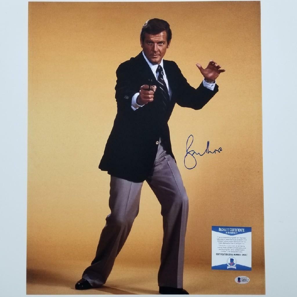 16x20 Photograph Signed by Roger Moore as James Bond with Beckett Authentication: 16x20 Photograph Signed by Roger Moore as James Bond with Beckett Authentication This is an original 16x20 photograph signed by Roger Moore, known for his role as James Bond 007. The autograph has bee