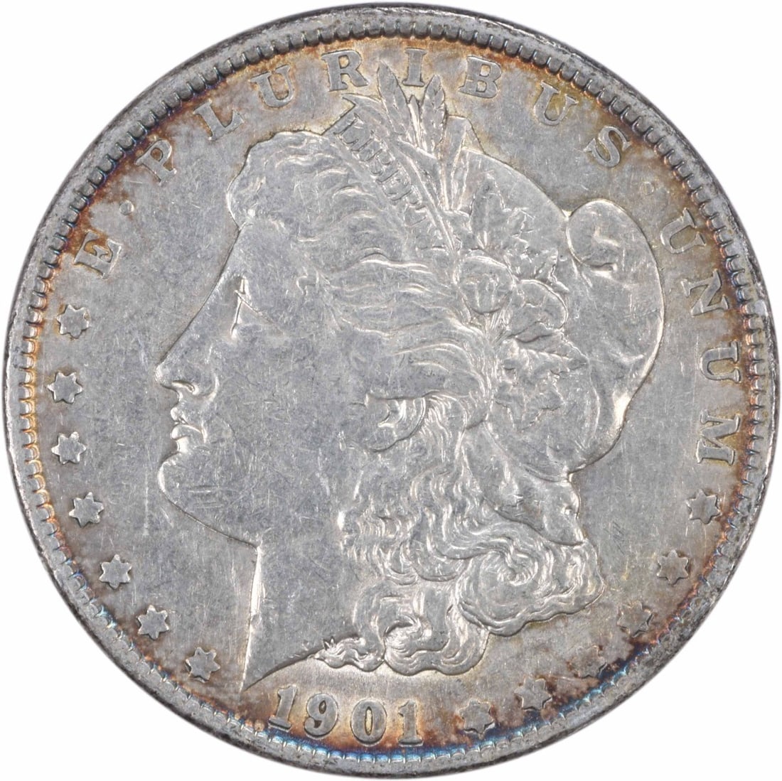 1901 Morgan Silver Dollar Uncertified by George T Morgan: 1901 Morgan Silver Dollar Uncertified by George T Morgan This 1901 Morgan Silver Dollar is an exquisite piece of numismatic history, showcasing the artistry of designer George T. Morgan. The coin is c