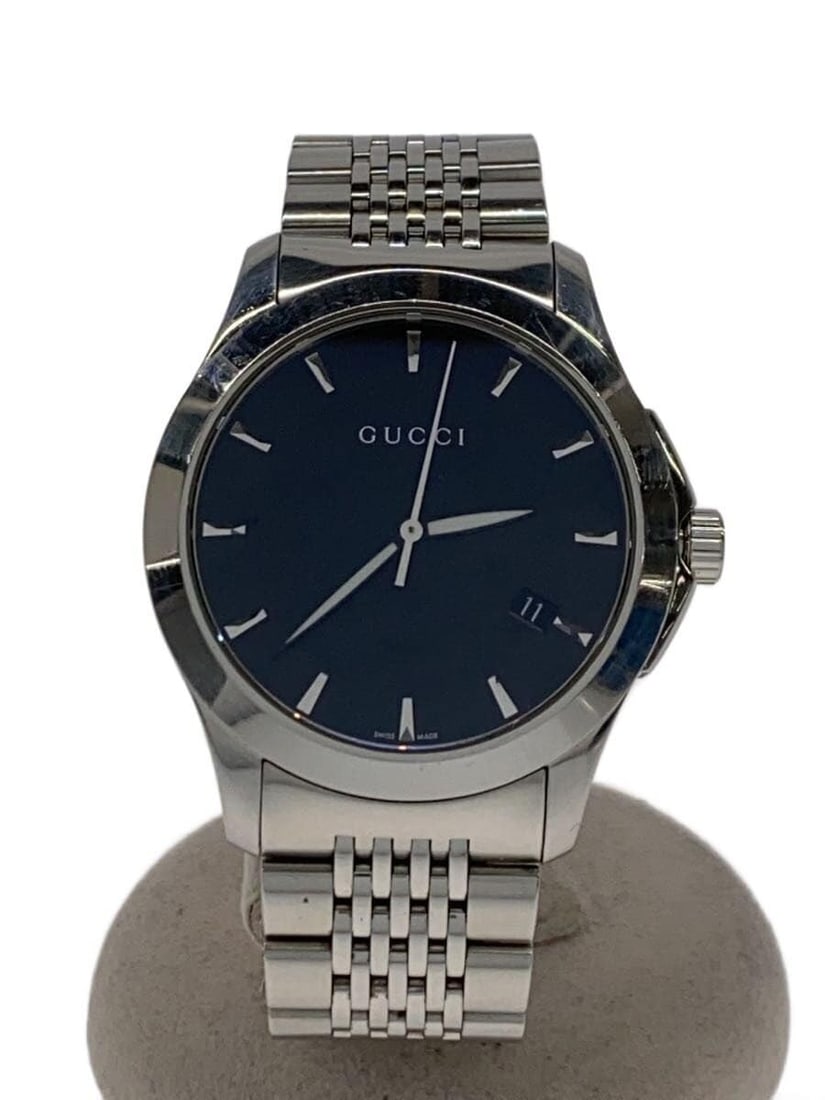 Gucci G Timeless Quartz Men's Wristwatch Black 246.4: Gucci G Timeless Quartz Men's Wristwatch Black 246.4 This GUCCI G-TIMELESS Quartz 246.4 men's wristwatch features a classic black design and is crafted in Switzerland. The watch is pre-owned and grade