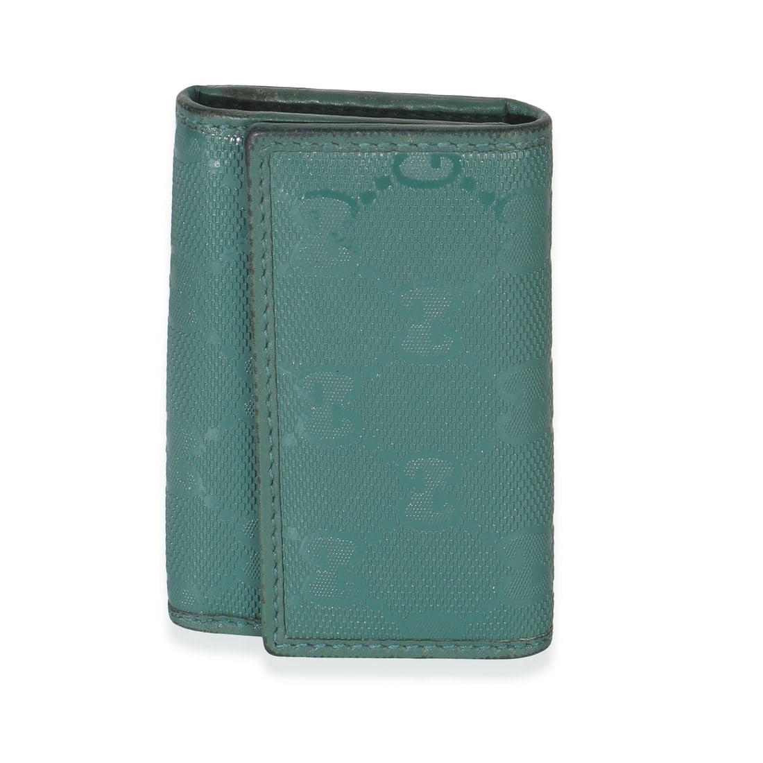 Green Leather Key Holder Pouch by Gucci Embossed GG Design: Green Leather Key Holder Pouch by Gucci Embossed GG Design This is a pre-owned Gucci green embossed GG leather key holder from 2009. Crafted in Italy, it features a green leather exterior with embosse