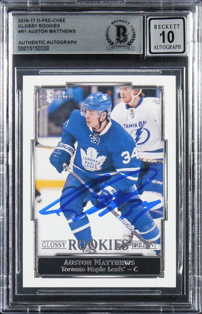 Auston Matthews Gem Mint 10 Signed 2016 O-Pee-Chee Rookie Card BAS Authenticated: Auston Matthews Gem Mint 10 Signed 2016 O-Pee-Chee Rookie Card BAS Authenticated This 2016 O-Pee-Chee Glossy Rookies #R1 card features a stunning autograph from Auston Matthews, the talented player of