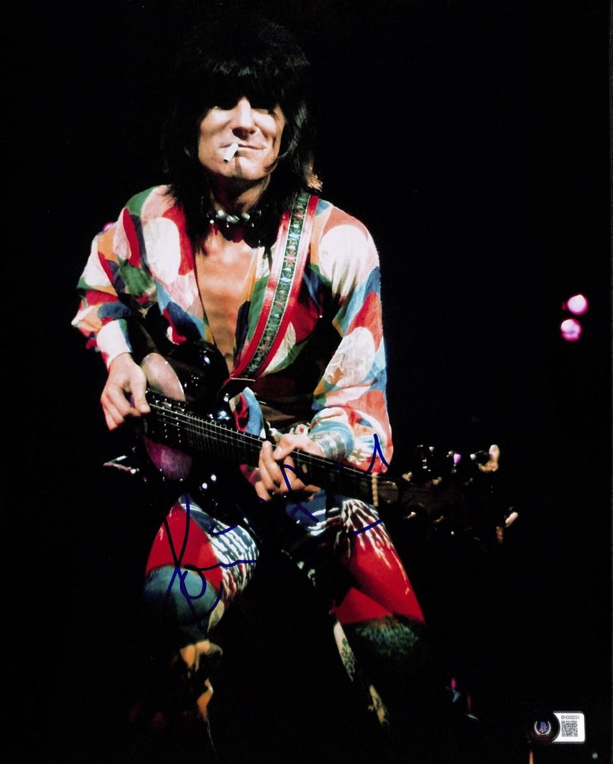 Ronnie Wood Signed 11X14 Photograph with Beckett Certification: Ronnie Wood Signed 11X14 Photograph with Beckett Certification This stunning 11x14 photograph features the iconic guitarist Ronnie Wood from the Rolling Stones, beautifully signed in blue permanent ma