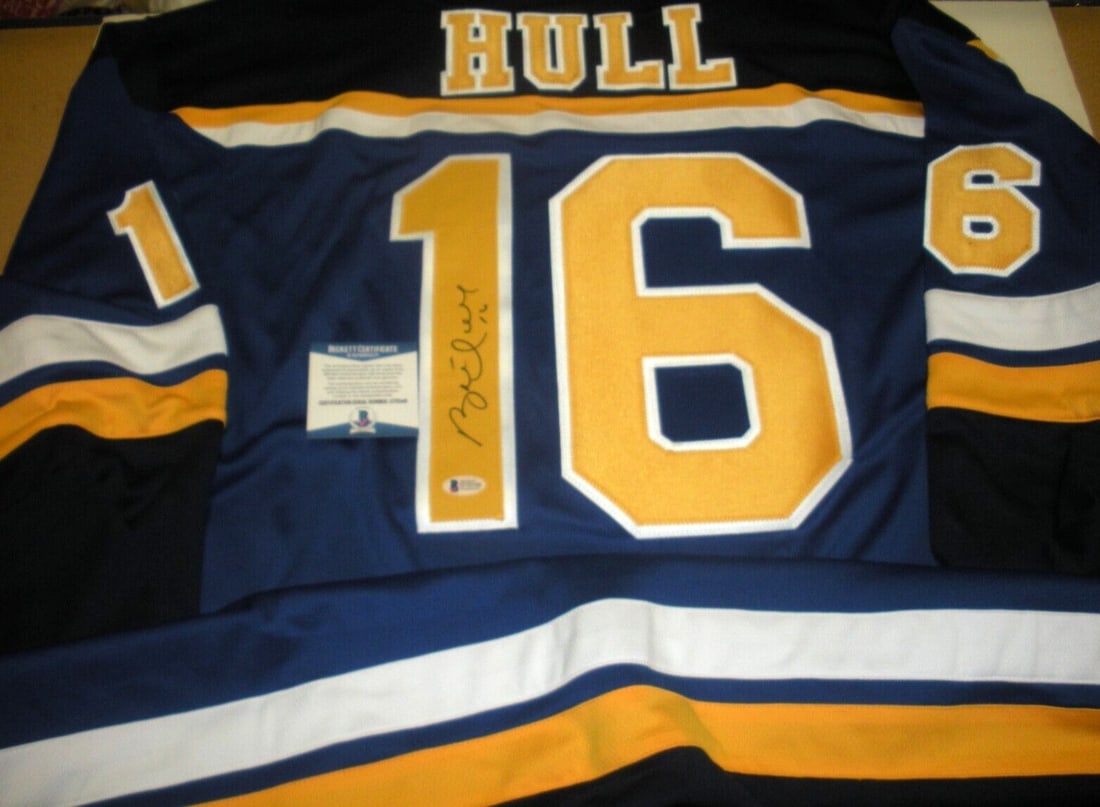 Brett Hull Signed St. Louis Blues Jersey with Beckett COA: Brett Hull Signed St. Louis Blues Jersey with Beckett COA This officially licensed St. Louis Blues jersey is signed by hockey legend Brett Hull, a prized addition for any fan or collector. The jersey 