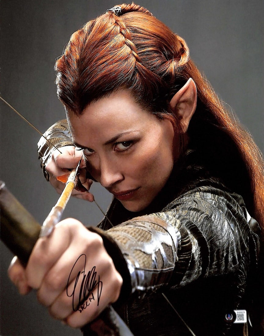 Lilly Evangeline Tauriel Autographed 11x14 Photo Beckett Certified: Lilly Evangeline Tauriel Autographed 11x14 Photo Beckett Certified This stunning 11x14 photograph features Lilly Evangeline as Tauriel in the iconic movie The Hobbit. The photo is autographed in black