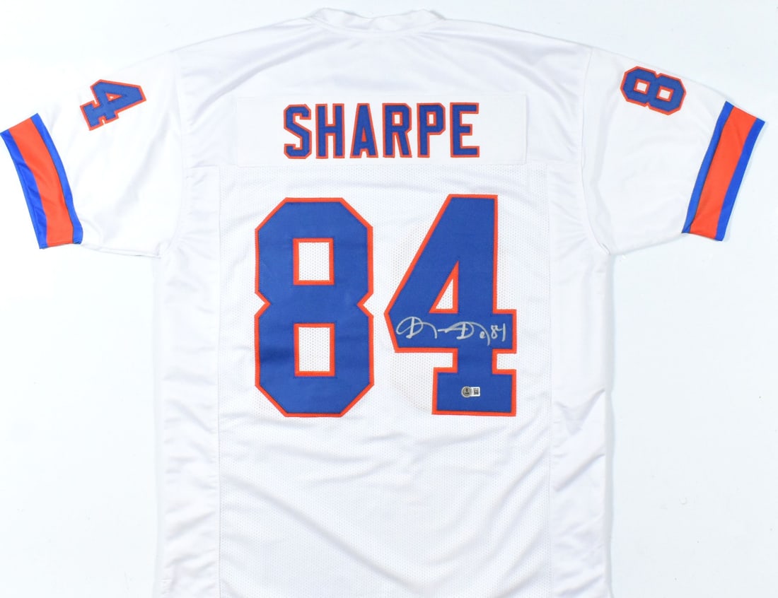 Shannon Sharpe Signed White Pro Style Football Jersey Beckett Hologram: Shannon Sharpe Signed White Pro Style Football Jersey Beckett Hologram This is a pre-owned white TB Pro Style football jersey autographed by Shannon Sharpe. The jersey features a Beckett W hologram fo