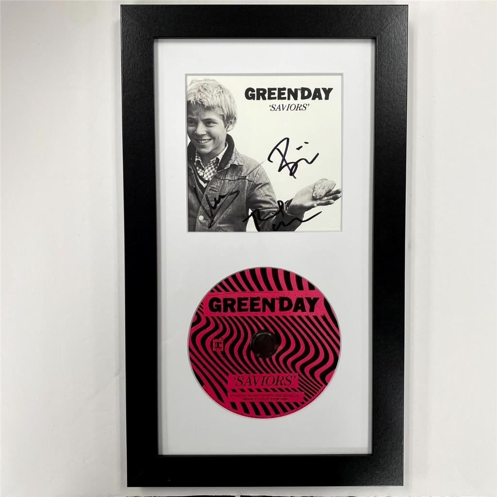 Beckett BAS Green Day signed Saviors CD booklet insert: Beckett BAS Green Day signed Saviors CD booklet insert This is an original CD insert from Green Day's "Saviors" album, signed by band members Armstrong, Dirnt, and Cool. The autographs are authenticat