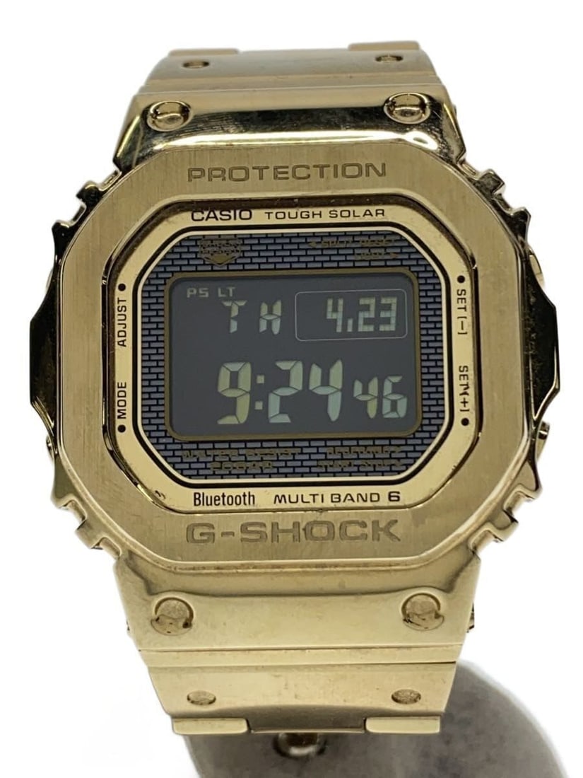 Casio G Shock Full Metal Gold Bluetooth Solar Wristwatch GMW-B5000GD-9JF: Casio G Shock Full Metal Gold Bluetooth Solar Wristwatch GMW-B5000GD-9JF This CASIO G-SHOCK GMW-B5000GD-9JF is a full metal wristwatch designed for men, featuring a gold finish. The watch is solar-pow
