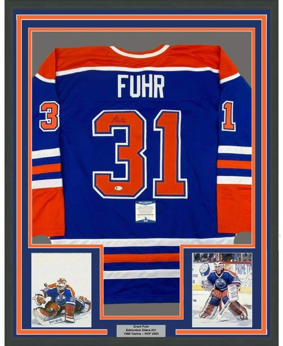 Framed Autographed Grant Fuhr Edmonton Oilers Jersey Beckett BAS COA 33x42: Framed Autographed Grant Fuhr Edmonton Oilers Jersey Beckett BAS COA 33x42 Celebrate the legacy of Grant Fuhr with this professionally framed and autographed 33x42 Edmonton Oilers jersey. This strikin