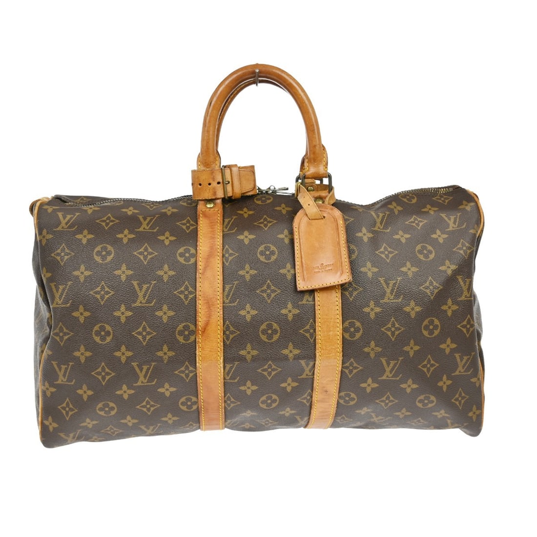 Keepall Monogram Canvas Travel Bag by Louis Vuitton: Keepall Monogram Canvas Travel Bag by Louis Vuitton The Louis Vuitton Keepall Bag features the signature monogram canvas in brown and is designed for unisex use. The exterior displays scuffs, scratche