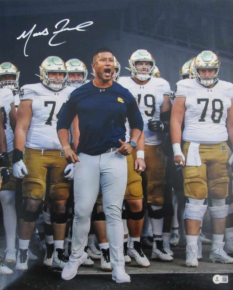 Autographed 16x20 Photo Marcus Freeman Notre Dame Football Beckett Authenticated: Autographed 16x20 Photo Marcus Freeman Notre Dame Football Beckett Authenticated This is an original 16x20 photo signed by Marcus Freeman, head coach of Notre Dame Football. The autograph has been aut