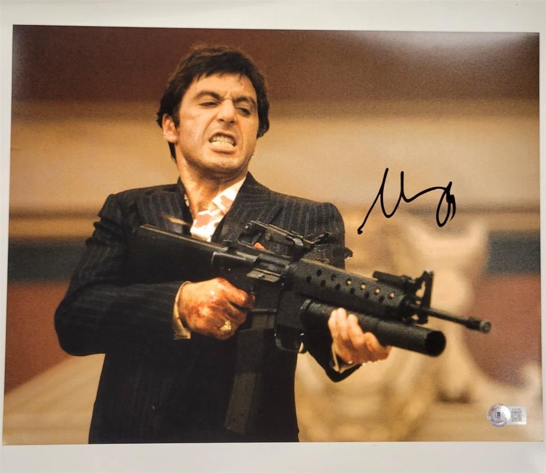 Al Pacino Scarface 11x14 Signed Photo Beckett Authenticated: Al Pacino Scarface 11x14 Signed Photo Beckett Authenticated This original 11x14 photograph of Al Pacino is a striking piece from the iconic movie Scarface. The photograph features a bold autograph fro