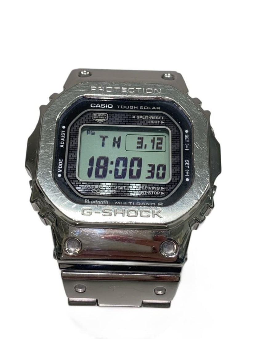 Casio G-Shock GMW-B5000D-1JF Men's Wristwatch: Casio G-Shock GMW-B5000D-1JF Men's Wristwatch This CASIO G-SHOCK GMW-B5000D-1JF men's wristwatch is a pre-owned timepiece in slightly used condition. Made in Japan, it features a robust and iconic des