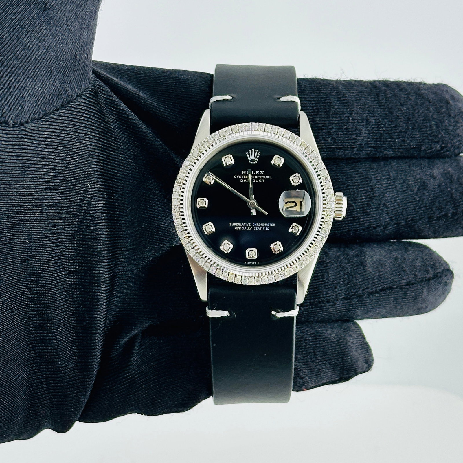 AM Black Diamond Dial Rolex Datejust Ref 1601 with Aftermarket Leather Strap: AM Black Diamond Dial Rolex Datejust Ref 1601 with Aftermarket Leather Strap This Rolex Datejust features an aftermarket black diamond dial and a prong-set diamond bezel, complemented by an aftermarke
