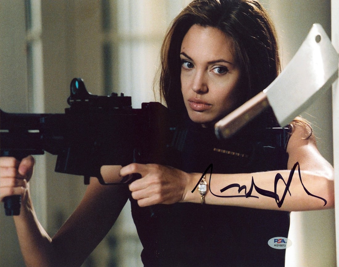 Autographed 11x14 Photograph Signed by Angelina Jolie with PSA DNA Authentication: Autographed 11x14 Photograph Signed by Angelina Jolie with PSA DNA Authentication This is an original 11x14 horizontal photograph personally signed by Angelina Jolie from the film Mr. & Mrs. Smith. Th