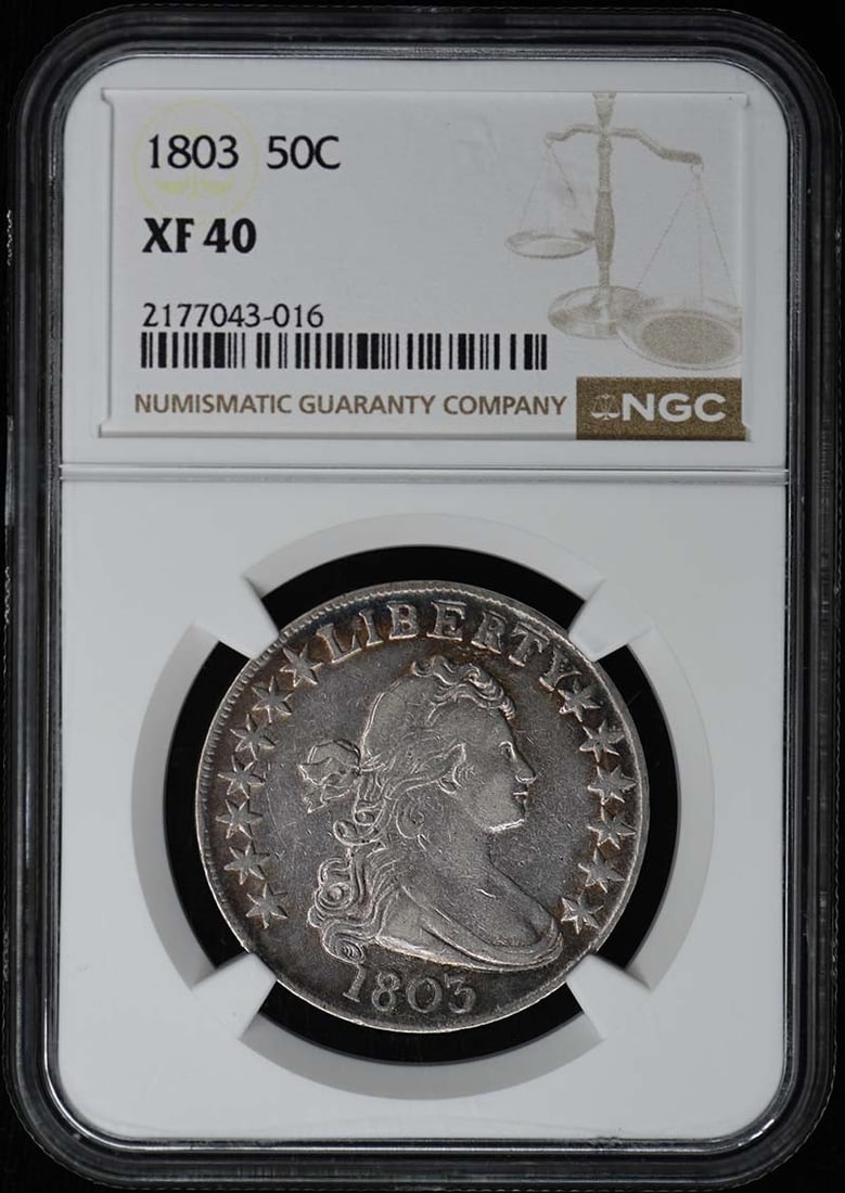 1803 Draped Bust Half Dollar NGC XF40 Large Eagle: 1803 Draped Bust Half Dollar NGC XF40 Large Eagle This 1803 Draped Bust, Large Eagle half dollar has been certified by NGC with a grade of XF40. Struck in Philadelphia, this circulated coin is an exam