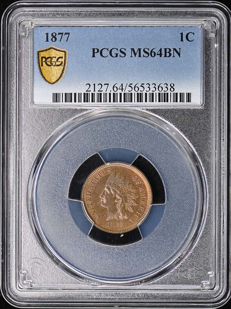 PCGS MS64BN 1877 Indian Head Cent Bronze: PCGS MS64BN 1877 Indian Head Cent Bronze This 1877 Indian Cent is a Type 3 bronze coin graded MS64BN by PCGS. It is an uncirculated piece from the Philadelphia Mint, featuring the classic Indian Cent 