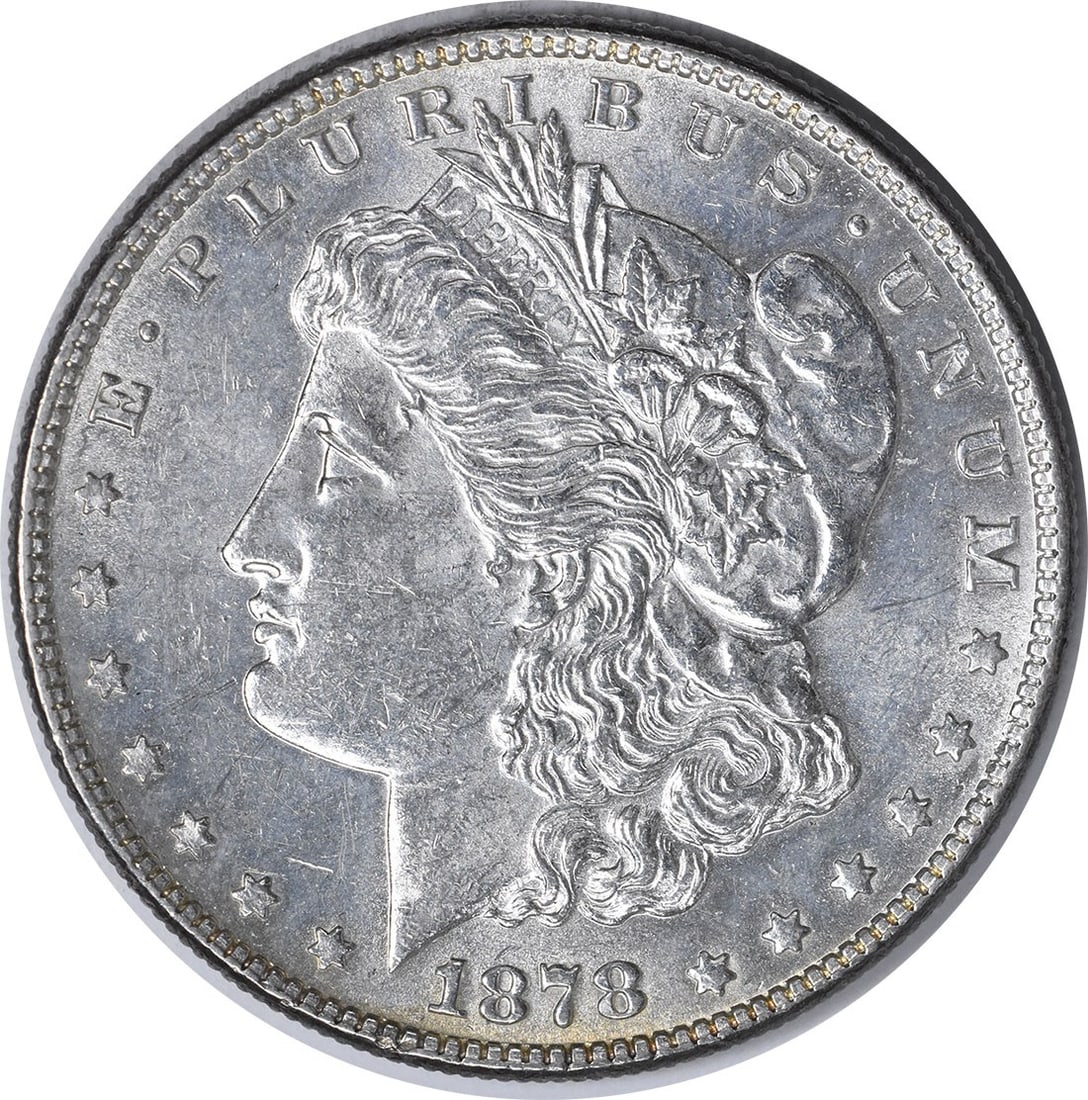 1878 Morgan Dollar 7 Tail Feathers Reverse Philadelphia AU Uncertified US Coin: 1878 Morgan Dollar 7 Tail Feathers Reverse Philadelphia AU Uncertified US Coin This is an 1878 Morgan Silver Dollar featuring the 7 Tail Feathers Reverse of 1878 design. Minted in Philadelphia, this c