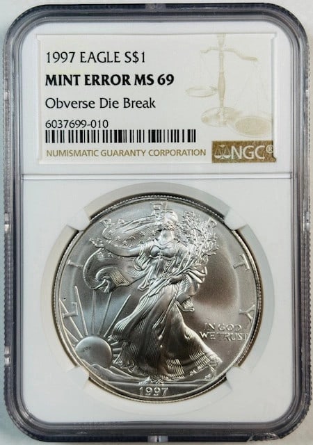 1997 Silver Eagle NGC MS69 Broken Head Die Break: 1997 Silver Eagle NGC MS69 Broken Head Die Break This 1997 Silver Eagle coin features a notable obverse die break, often referred to as the "Broken Head" error. Graded MS-69 by NGC, this uncirculated 