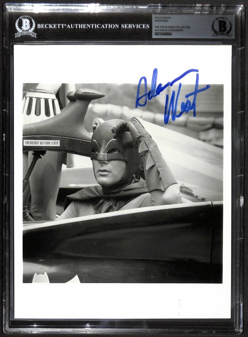 Adam West Signed 8x10 Batman Batmobile Photo BECKETT Authenticated Rare Image: Adam West Signed 8x10 Batman Batmobile Photo BECKETT Authenticated Rare Image This striking 8x10 black-and-white photograph features Adam West as Batman, signed in bold blue marker. Capturing the lege
