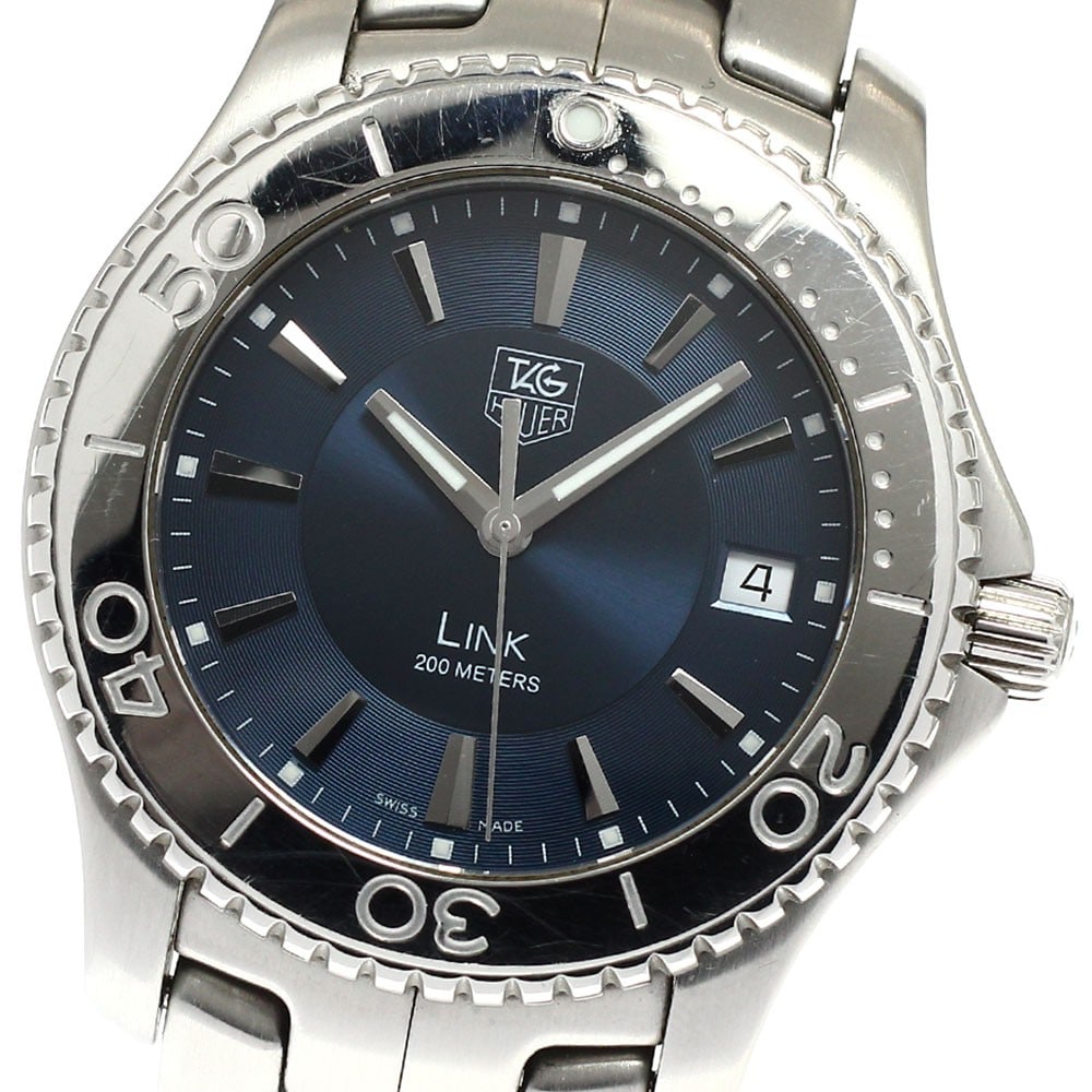 TAG Heuer Link Date Quartz Stainless Steel Men's Wristwatch WJ1112-0: TAG Heuer Link Date Quartz Stainless Steel Men's Wristwatch WJ1112-0 This TAG Heuer Link Date Quartz men's wristwatch, model WJ1112-0, features a stainless steel case and bracelet with a navy dial. Th