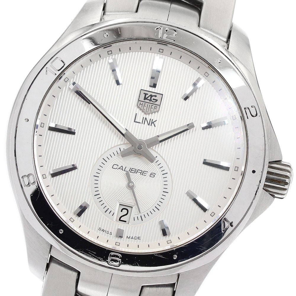 TAG Heuer Link Caliber 6 Automatic Men's Steel Watch WAT2111 Small Seconds: TAG Heuer Link Caliber 6 Automatic Men's Steel Watch WAT2111 Small Seconds This TAG Heuer Link Caliber 6 men's wristwatch features a stainless steel case and band with a silver dial. The watch is powe