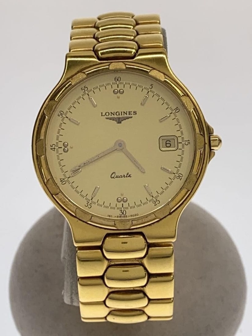 Longines Conquest Date Quartz Gold Men's Wristwatch L1.614.2: Longines Conquest Date Quartz Gold Men's Wristwatch L1.614.2 This is a Longines Conquest Date Quartz men's wristwatch, model L1.614.2. The watch features a gold-tone case with a classic design and a d
