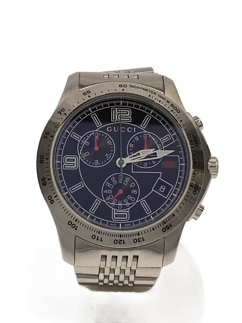 Gucci G Timeless men's Swiss quartz wristwatch: Gucci G Timeless men's Swiss quartz wristwatch This GUCCI G-TIMELESS quartz wristwatch is designed for men and features a Swiss-made movement. The watch is pre-owned and graded as B, showing slight si