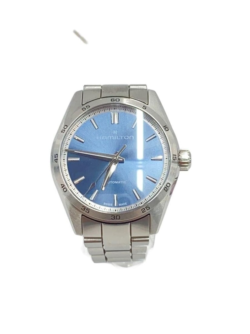 Hamilton Jazzmaster Silver Men's Wristwatch H361050: Hamilton Jazzmaster Silver Men's Wristwatch H361050 This is a pre-owned HAMILTON Jazzmaster H361050 men's wristwatch, crafted in Switzerland. The watch features a silver case and dial, with a band des