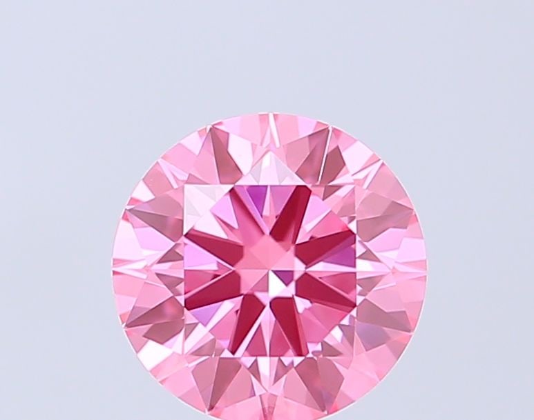 Ideal Loose Diamond - ROUND 1.03ct Fancy Vivid Pink VVS2: Ideal Loose Diamond - ROUND 1.03ct Fancy Vivid Pink VVS2 Source: This is a real non-mined Diamond that has been grown in a lab Shape: ROUND Carats: 1.03 Color: Fancy Vivid Pink Certification: IGI Vide