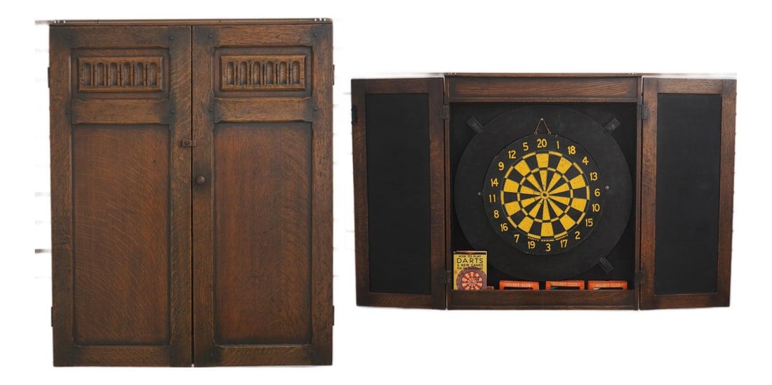 English Feudal Oak Wall Cabinet with Dartboard Darts and Chalk Scoreboard: English Feudal Oak Wall Cabinet with Dartboard Darts and Chalk Scoreboard This vintage hanging dart board cabinet is crafted in the English feudal oak style and dates to the 1930s. It features fine ca
