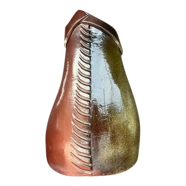 Handcrafted Studio Pottery Floor Vase with Earthy Boho Design: Handcrafted Studio Pottery Floor Vase with Earthy Boho Design This vintage studio pottery floor vase showcases a handcrafted design with a blend of earthy burnt umber tones, accented by rich browns an