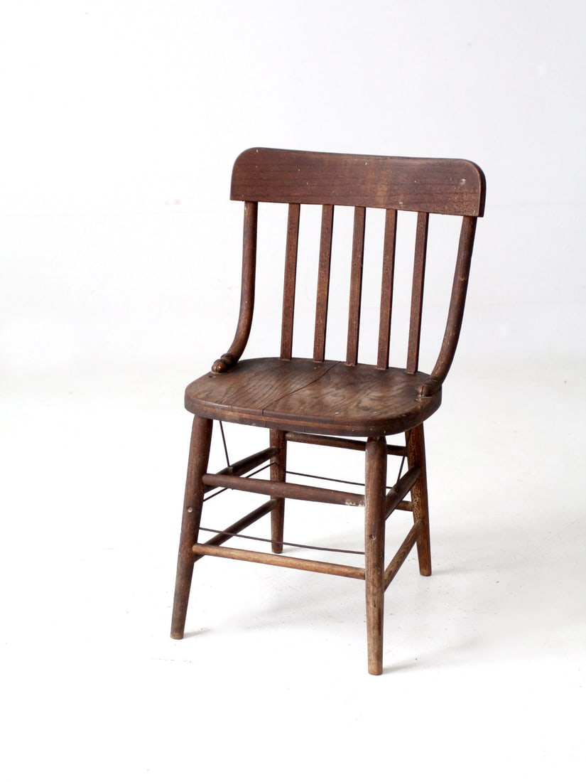 1940 Vintage Slat Back Wood Chair with Metal Bracing: 1940 Vintage Slat Back Wood Chair with Metal Bracing This vintage slat back chair, crafted from wood in 1940, features a stylish design with clean lines and metal wire bracing, making it a timeless ad