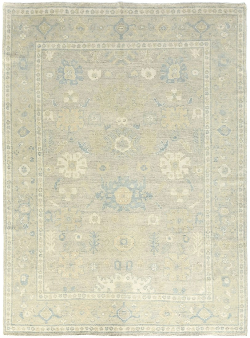Hand-Knotted Wool Oushak Floral Area Rug 9X12 Brown Gray: Hand-Knotted Wool Oushak Floral Area Rug 9X12 Brown Gray This is a handmade Oushak-style area rug featuring a floral pattern in muted pastel colors, including brown, cream, and blue. Crafted from wool