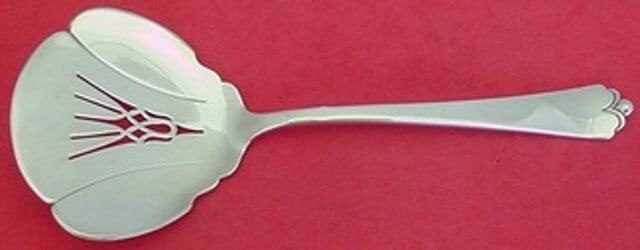 Watson-Wallace Lotus Sterling Silver Pierced Tomato Server 7.5": Watson-Wallace Lotus Sterling Silver Pierced Tomato Server 7.5" This exquisite tomato server from the Lotus pattern by Watson-Wallace is crafted from high-quality sterling silver. Measuring 7 1/2 inch