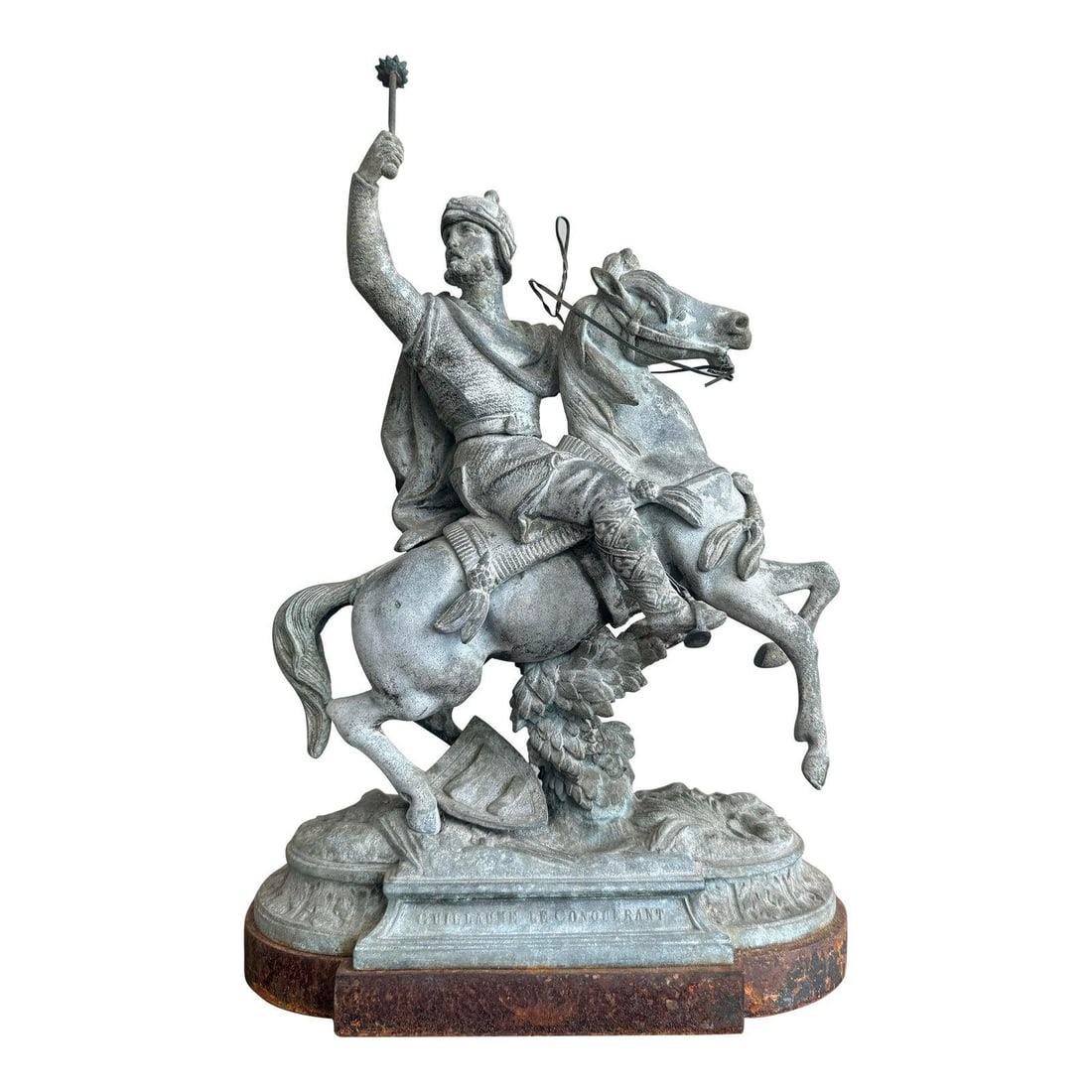 Vintage Warrior on Horseback Statue in Aged Bronze Finish: Vintage Warrior on Horseback Statue in Aged Bronze Finish This striking vintage statue features a victorious warrior on horseback, captured mid-charge in a dramatic pose. The sculpture is finished in 