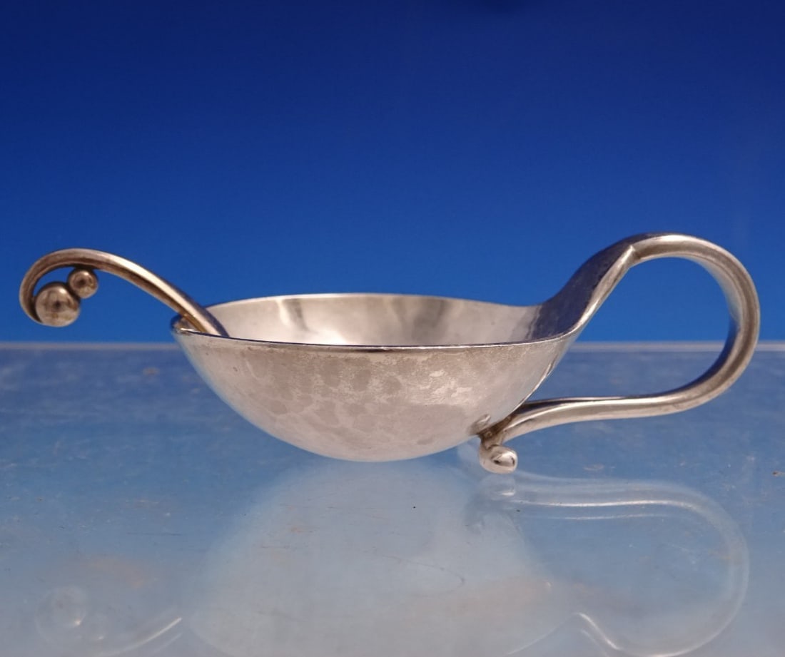 Sterling Silver Blossom Salt Cellar and Spoon Set by Georg Jensen GI Mark: Sterling Silver Blossom Salt Cellar and Spoon Set by Georg Jensen GI Mark Elegant sterling silver salt dip with spoon from the Blossom pattern by Georg Jensen. This two-piece set is marked with the GI