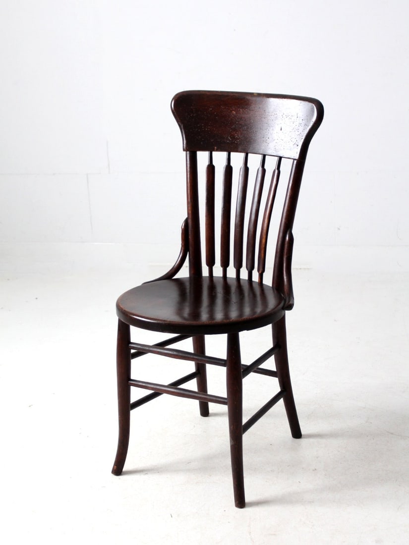 Antique Cattail Back Dining Chair by Koenig Furniture Co: Antique Cattail Back Dining Chair by Koenig Furniture Co Discover a charming piece of history with this early 20th-century wood dining chair crafted by Koenig Furniture Co. The chair showcases a class