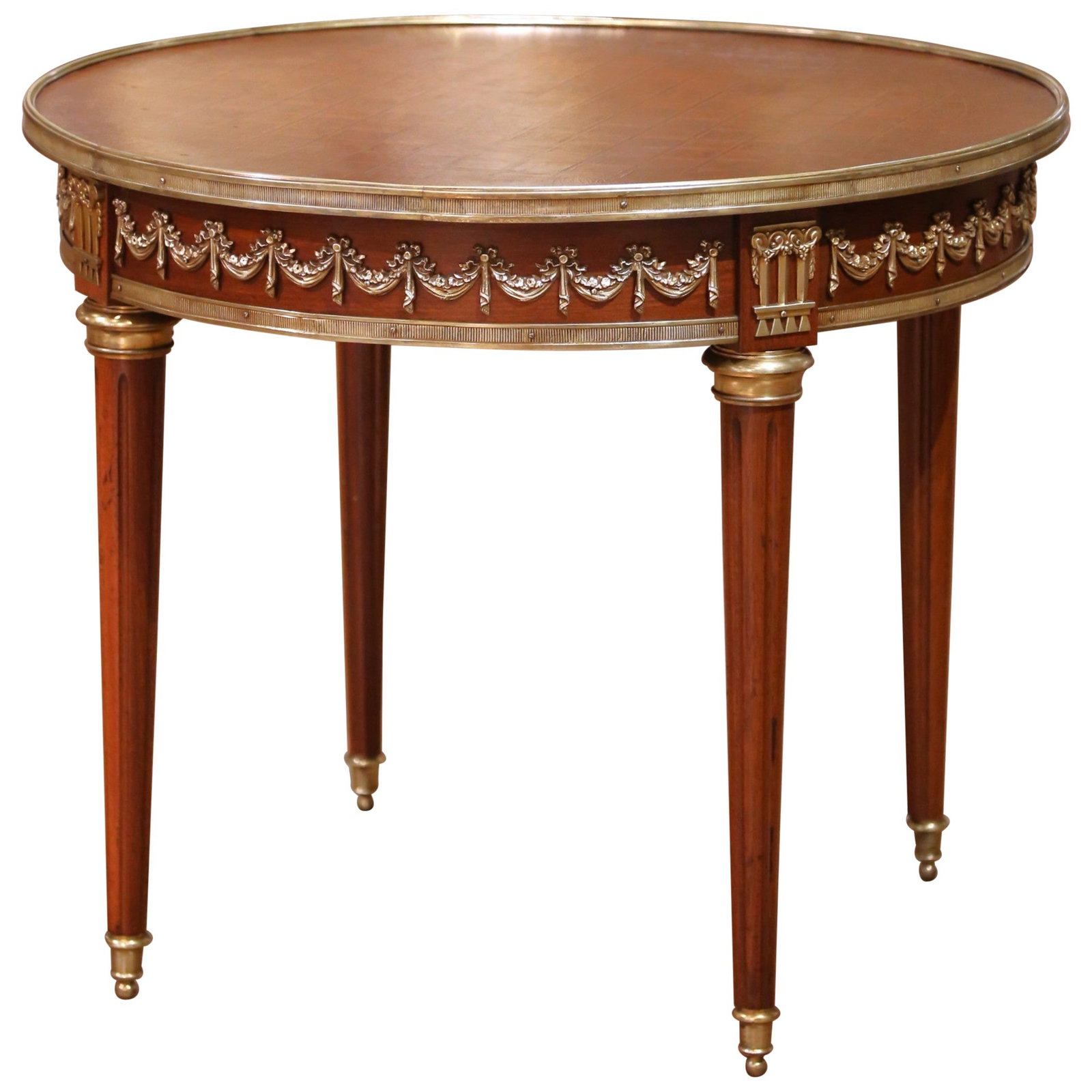 Louis XVI Style Mahogany Gueridon Table with Marquetry and Bronze Mounts: Louis XVI Style Mahogany Gueridon Table with Marquetry and Bronze Mounts This exquisite French Louis XVI-style gueridon, crafted circa 1930, showcases a round mahogany top with intricate marquetry in 