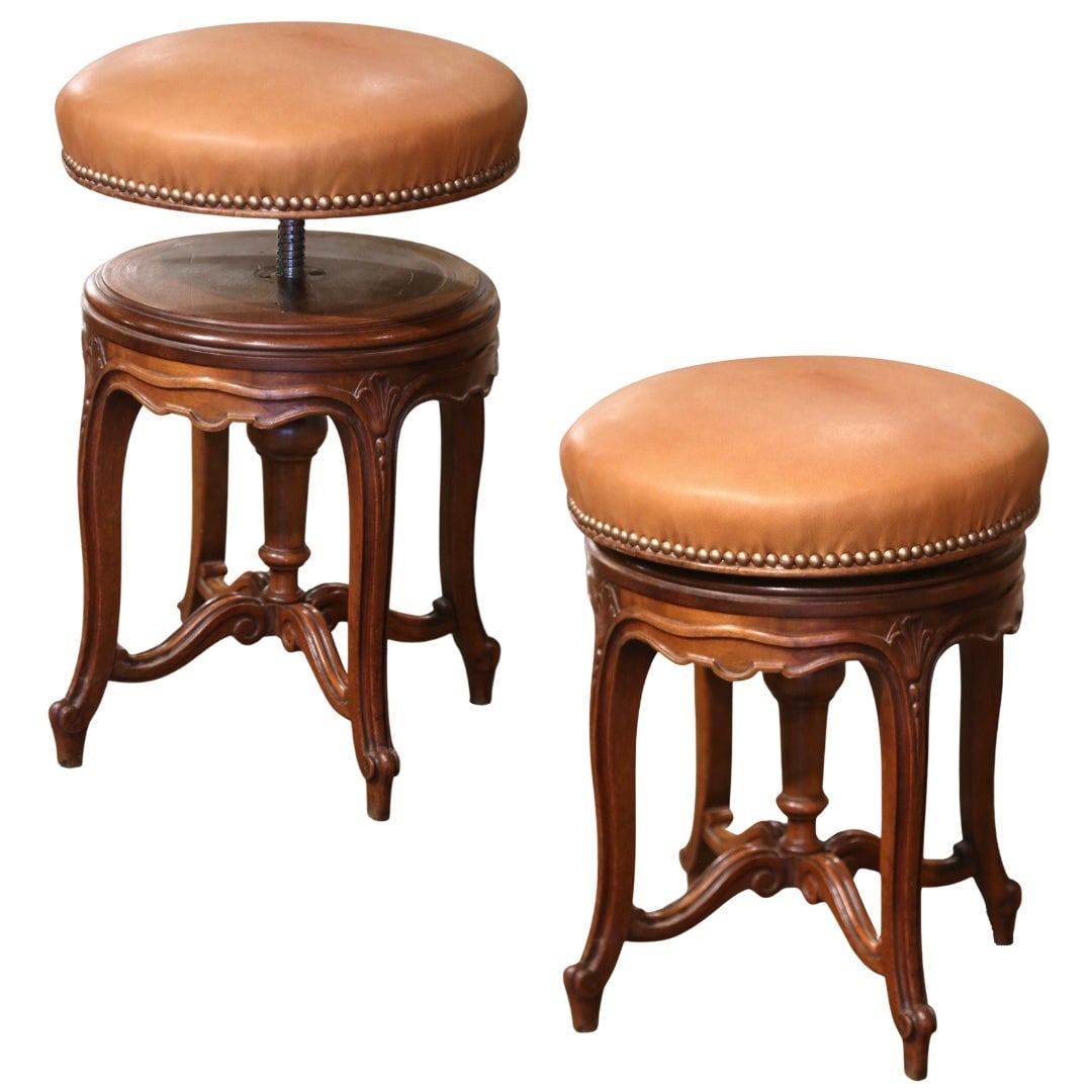19th Century French Louis XV Adjustable Walnut Piano Stool with Leather Upholstery: 19th Century French Louis XV Adjustable Walnut Piano Stool with Leather Upholstery This exquisite 19th Century French Louis XV Carved Walnut and Leather Adjustable Piano Stool features a stunning blen