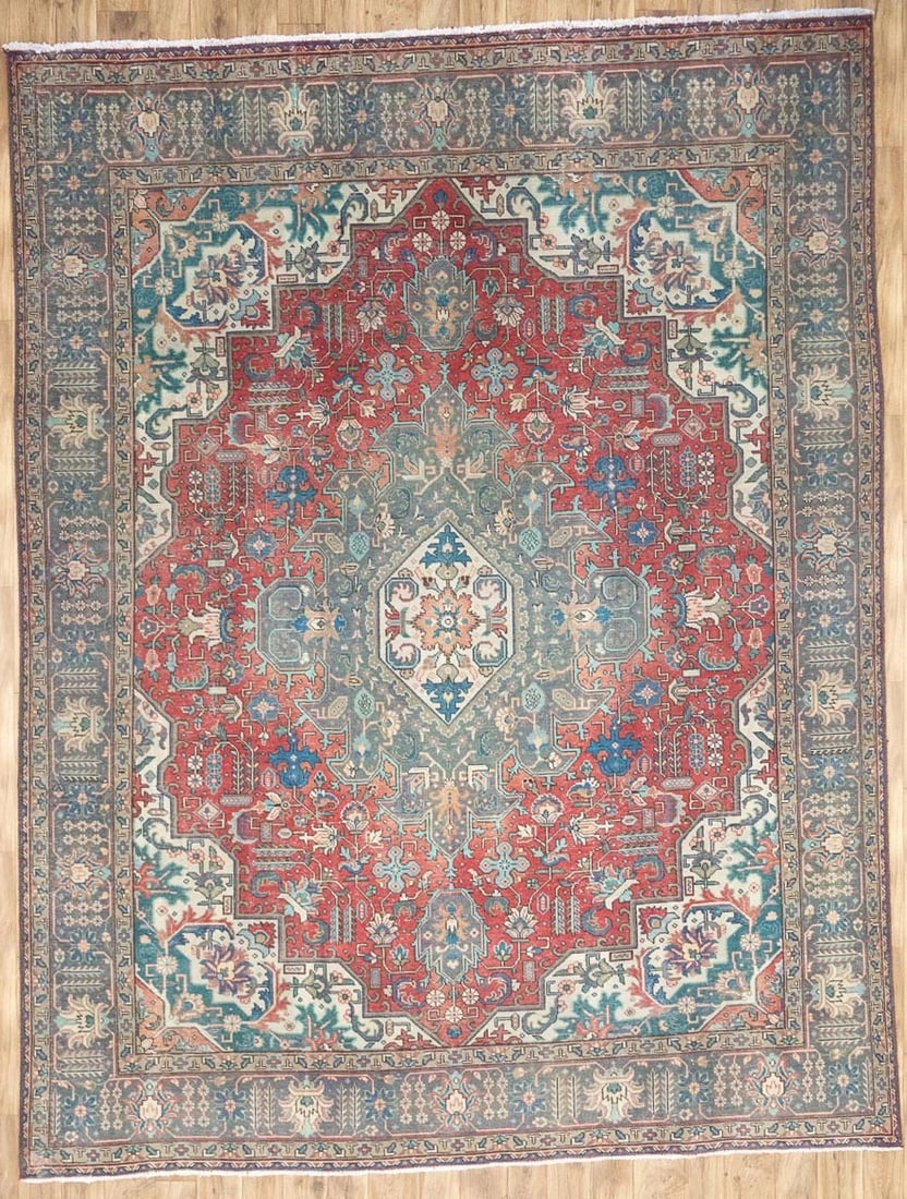 Vintage Hand Knotted Wool Floral Area Rug 9'9 x 12'8: Vintage Hand Knotted Wool Floral Area Rug 9'9 x 12'8 This semi-antique hand-knotted Oriental rug features a traditional floral pattern in muted tones of red, gray, cream, beige, teal, and green. Craft