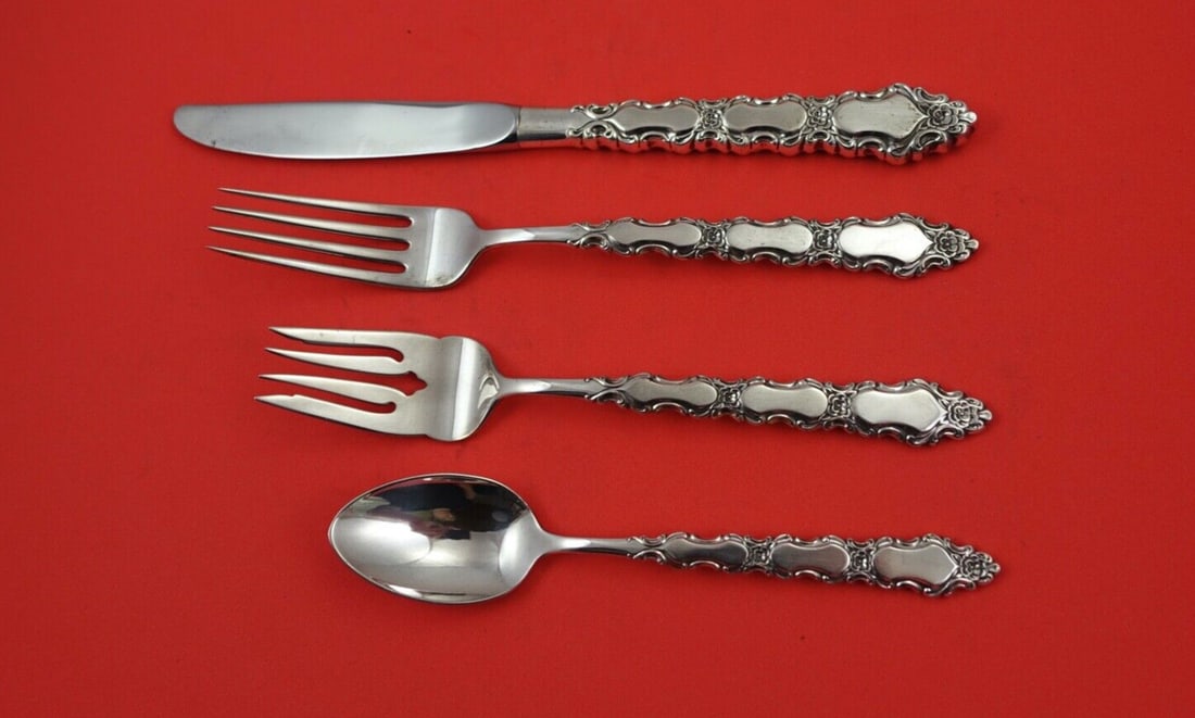 International Sterling Silver Grand Trianon 4-Piece Place Setting: International Sterling Silver Grand Trianon 4-Piece Place Setting Enhance your dining experience with this exquisite 4-piece place setting in the Grand Trianon pattern by International Sterling. This 