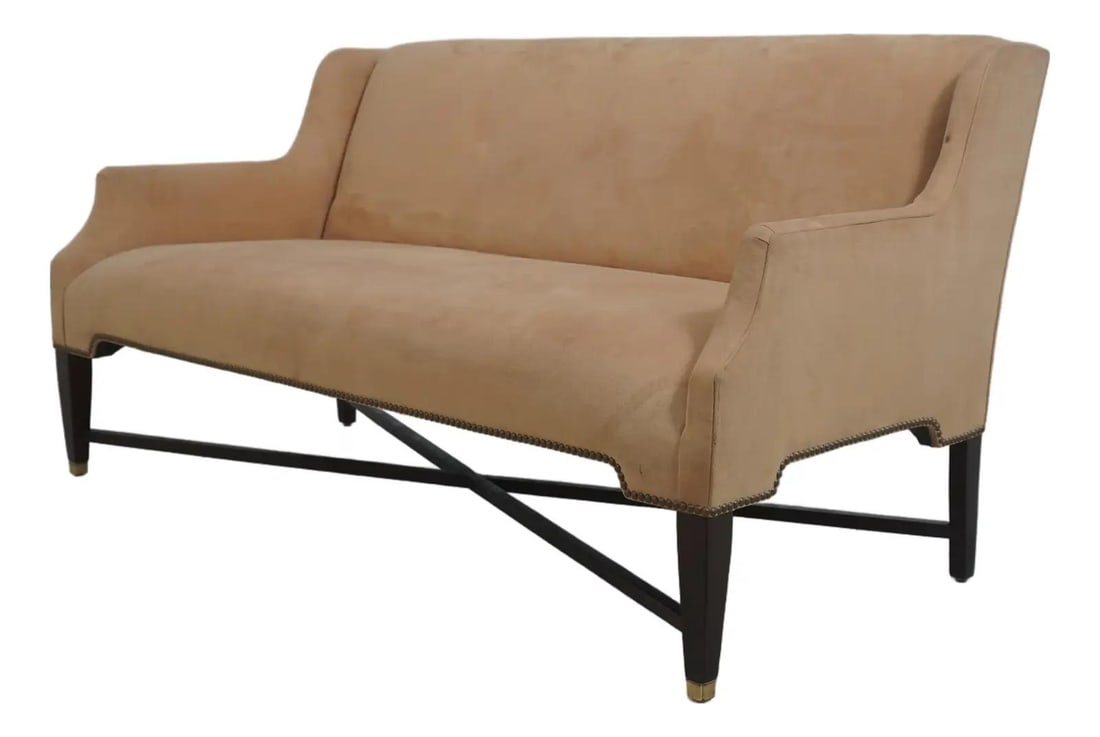 Mahogany Frame Suede Settee with Brass Feet and Tack Trim: Mahogany Frame Suede Settee with Brass Feet and Tack Trim This Edward Ferrell settee loveseat features a modern design with traditional style elements, including a mahogany stretcher base frame and ta